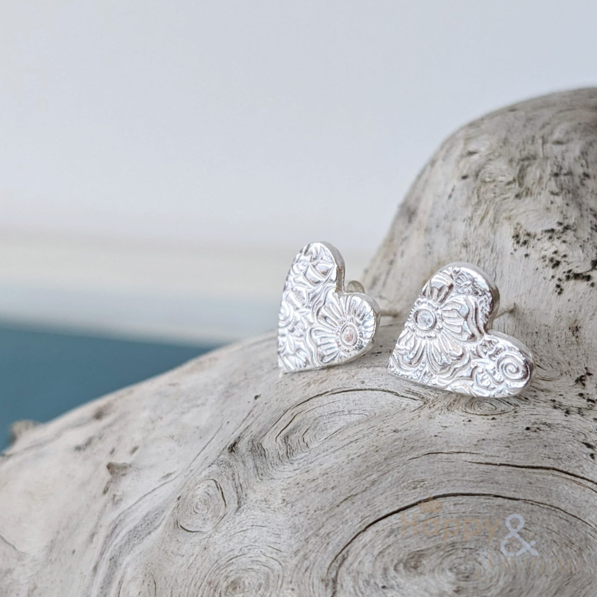 Sterling silver textured heart stud earrings