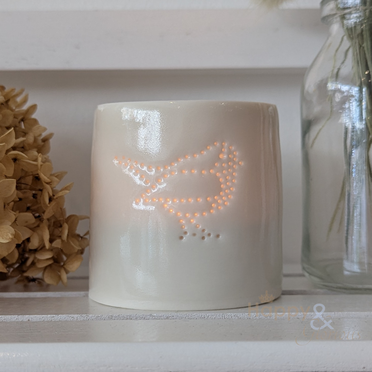 Porcelain robin tealight candle holder by Luna Lighting