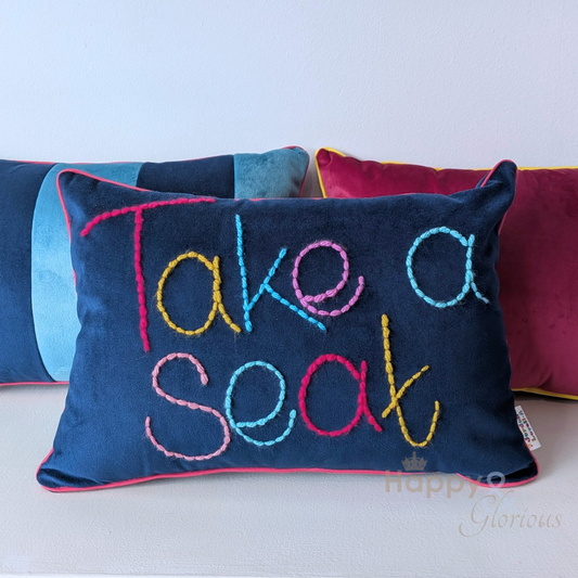 Take a Seat embroidered velvet cushion