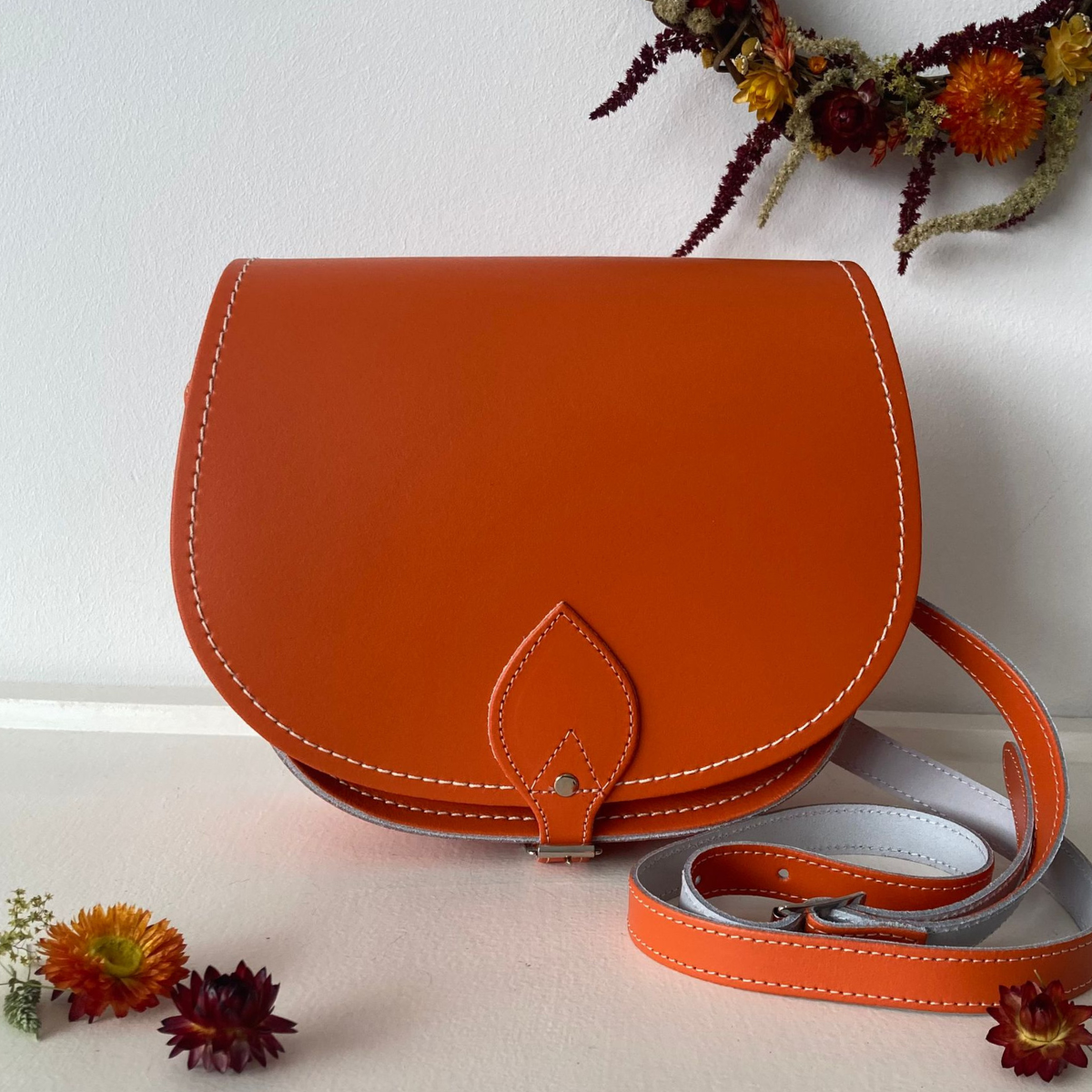 Orange handmade leather saddle bag