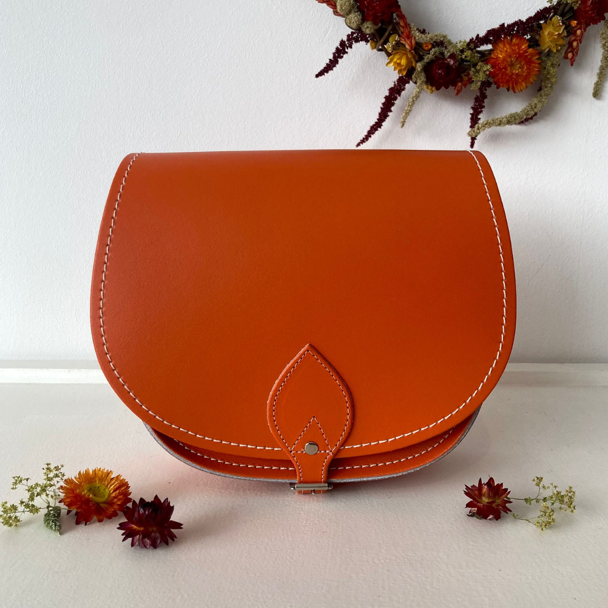 Orange handmade leather saddle bag