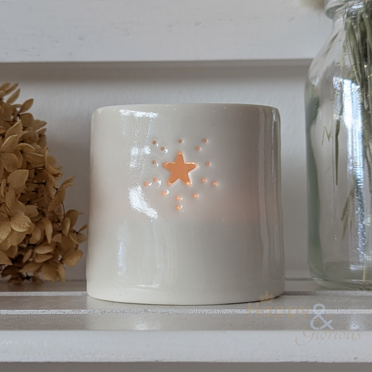 Porcelain starburst tealight candle holder by Luna Lighting