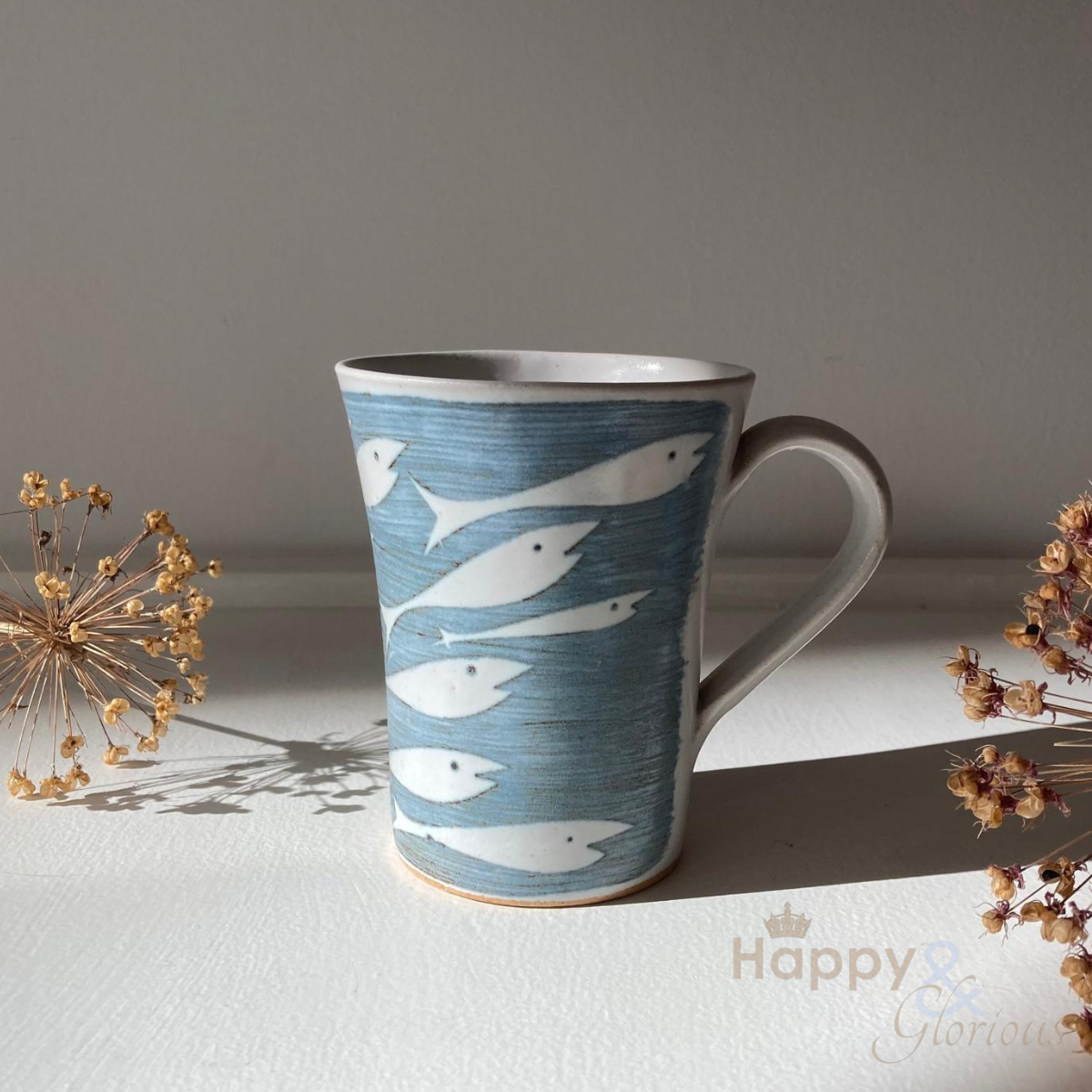 Handmade stoneware fishes mug