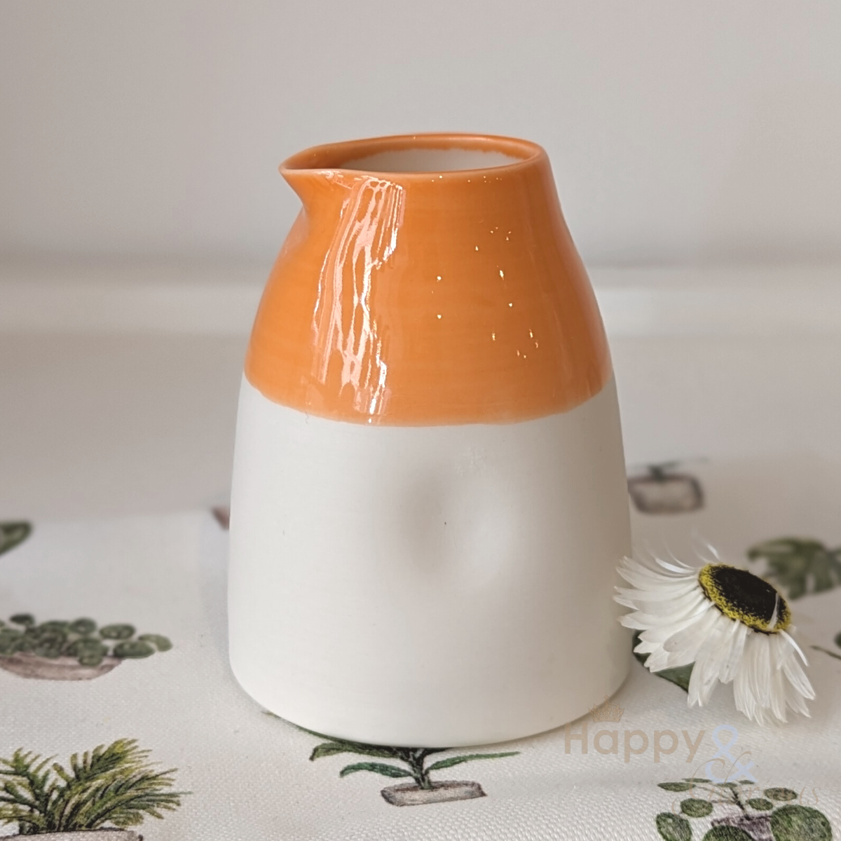 Orange porcelain collared jug