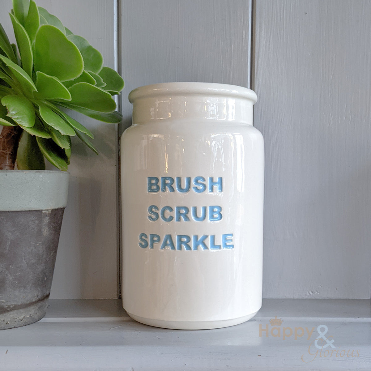 Blue ceramic 'brush, scrub, sparkle' utensil pot