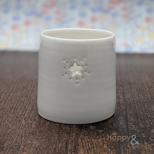 Porcelain starburst tealight candle holder by Luna Lighting