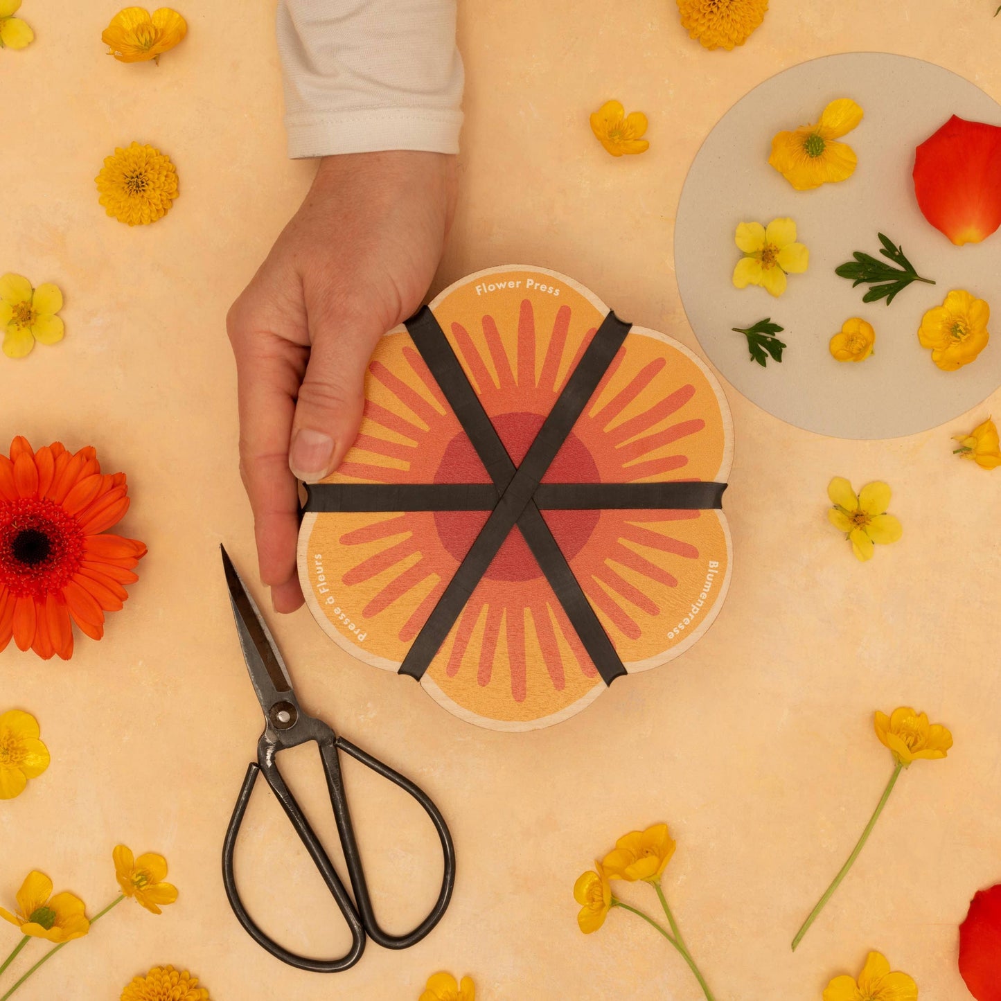 Yellow flower-shaped flower press