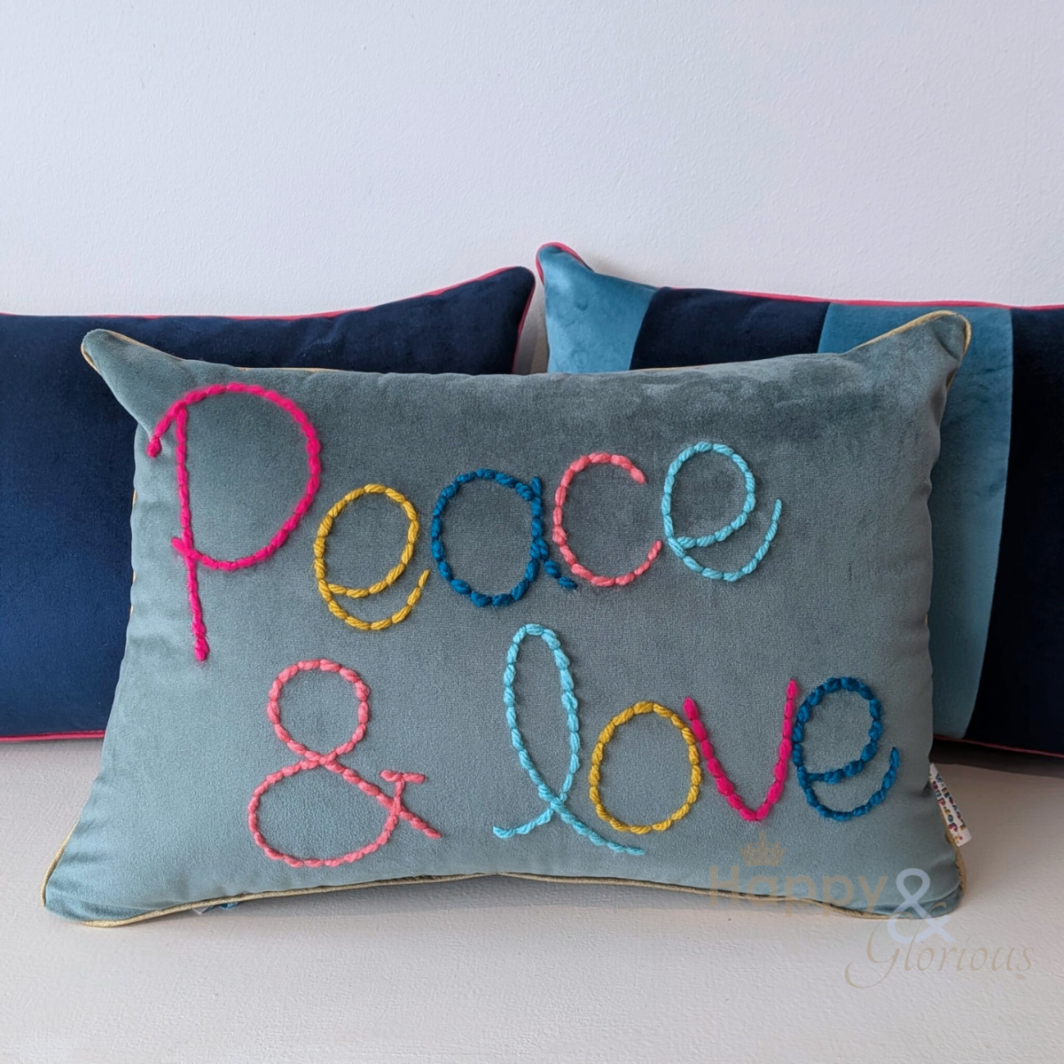 Peace & Love embroidered velvet cushion