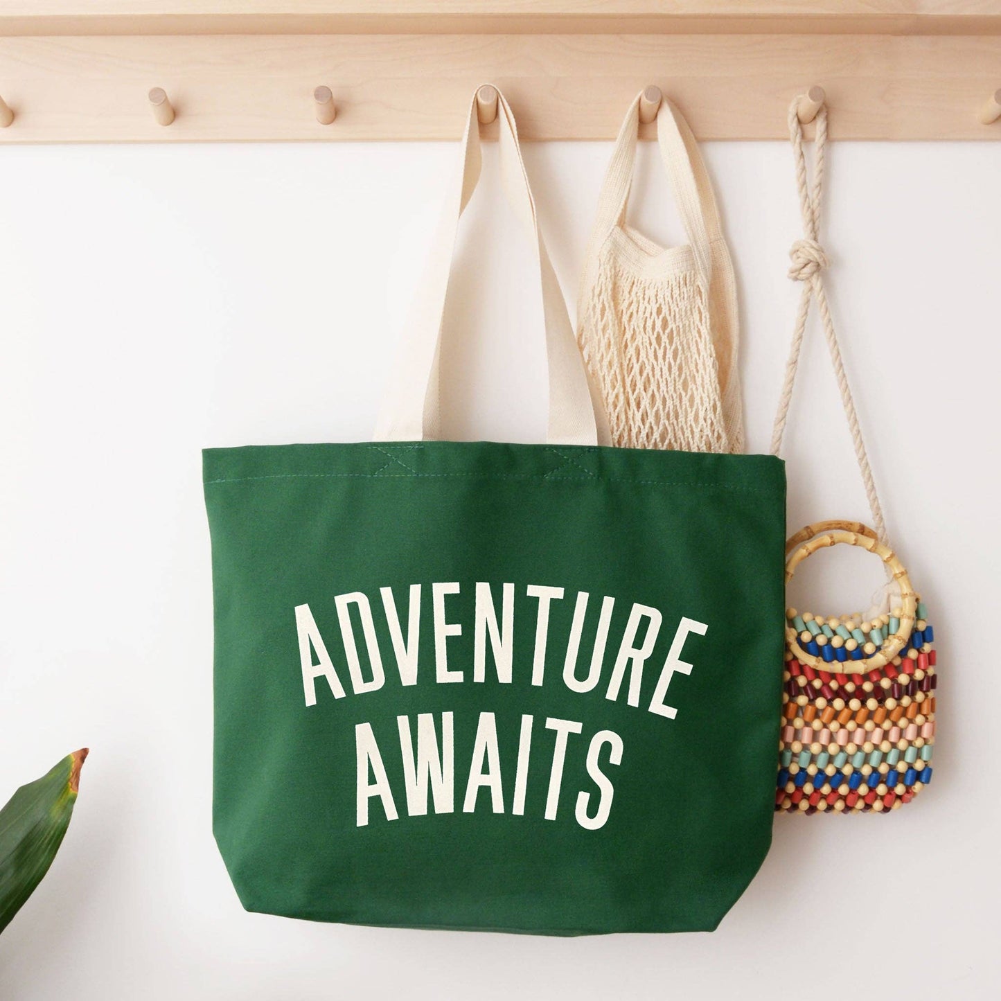 Adventure awaits forest green canvas tote bag