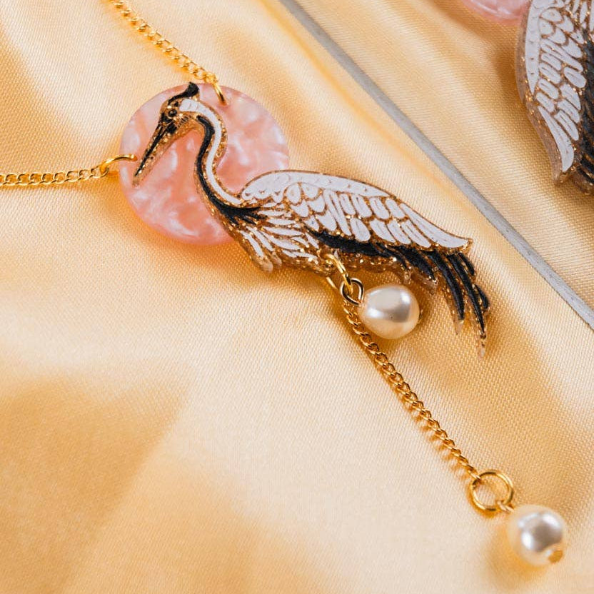 Crane pendant necklace by Tatty Devine