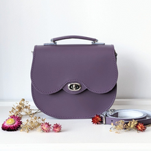 Grape purple twist lock leather saddle bag