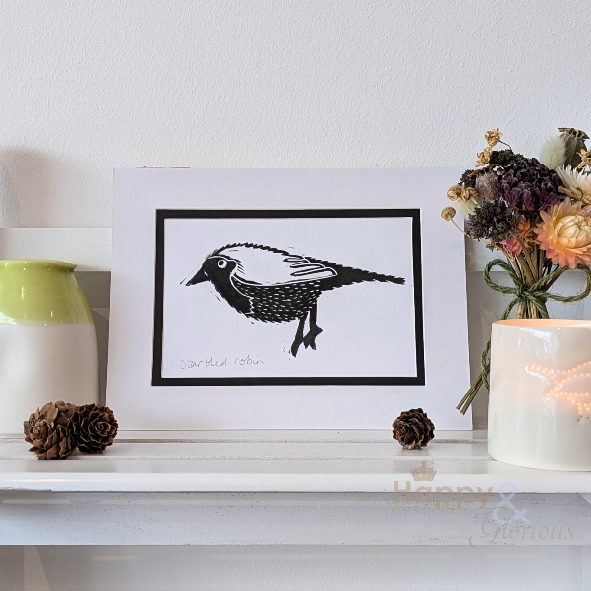 Startled robin lino print by Kate Tompsett