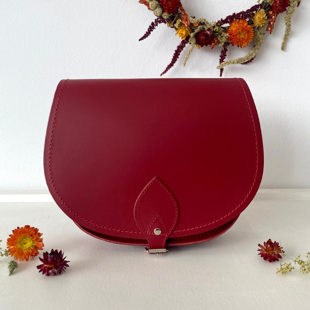Red handmade leather saddle bag