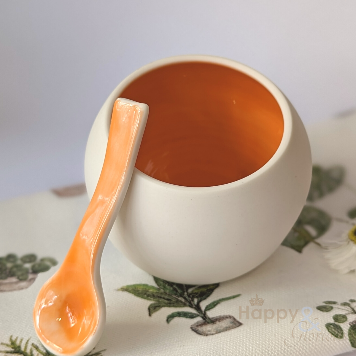Orange porcelain salt pig & spoon