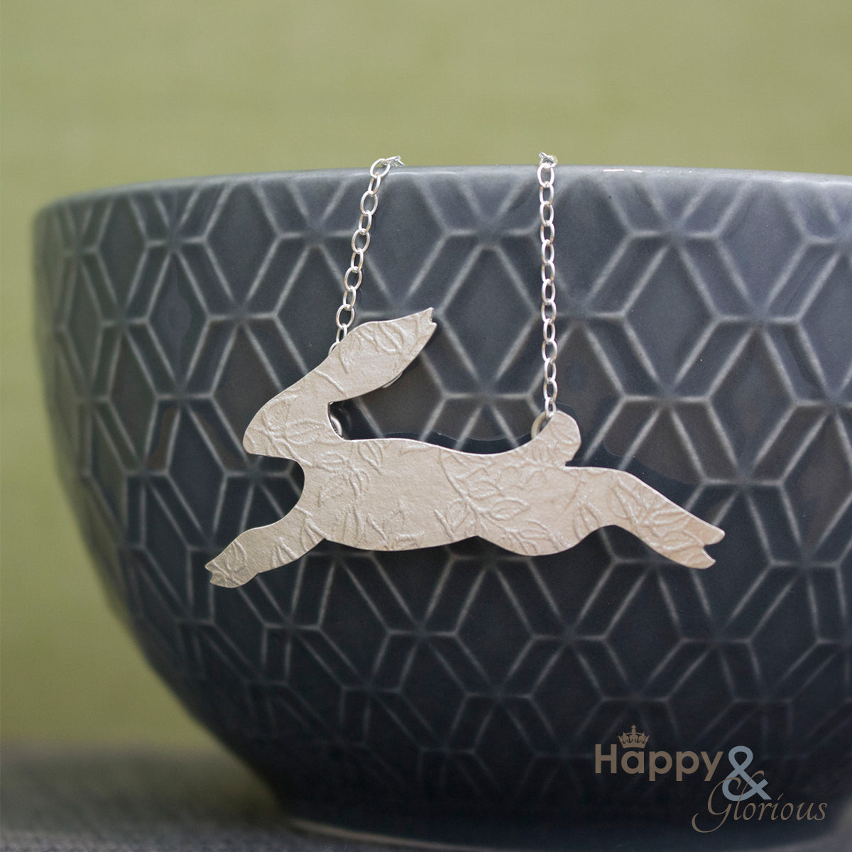Sterling silver embossed leaping hare necklace