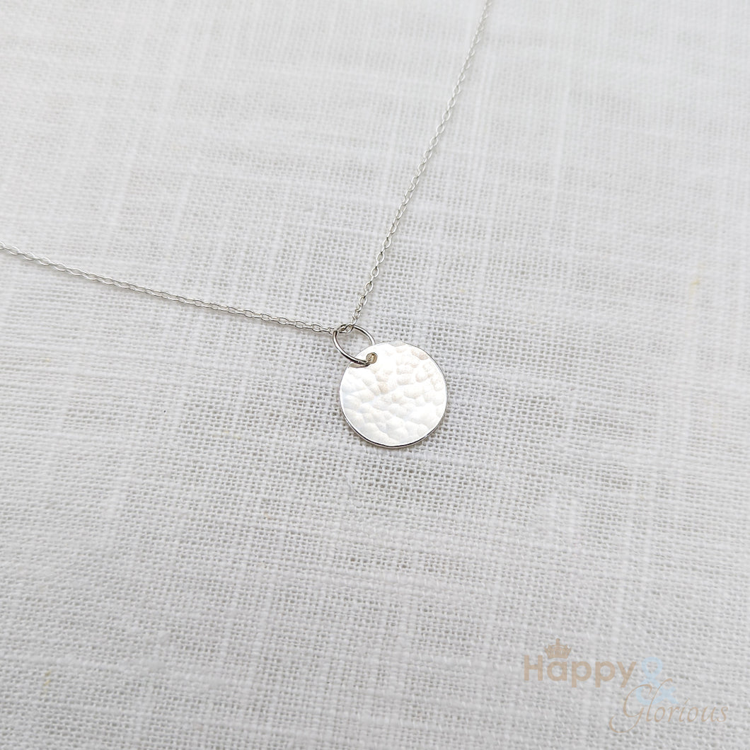 Sterling silver hammered disc charm necklace