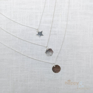 Sterling silver hammered disc charm necklace