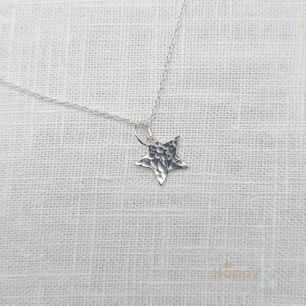 Sterling silver hammered star charm necklace