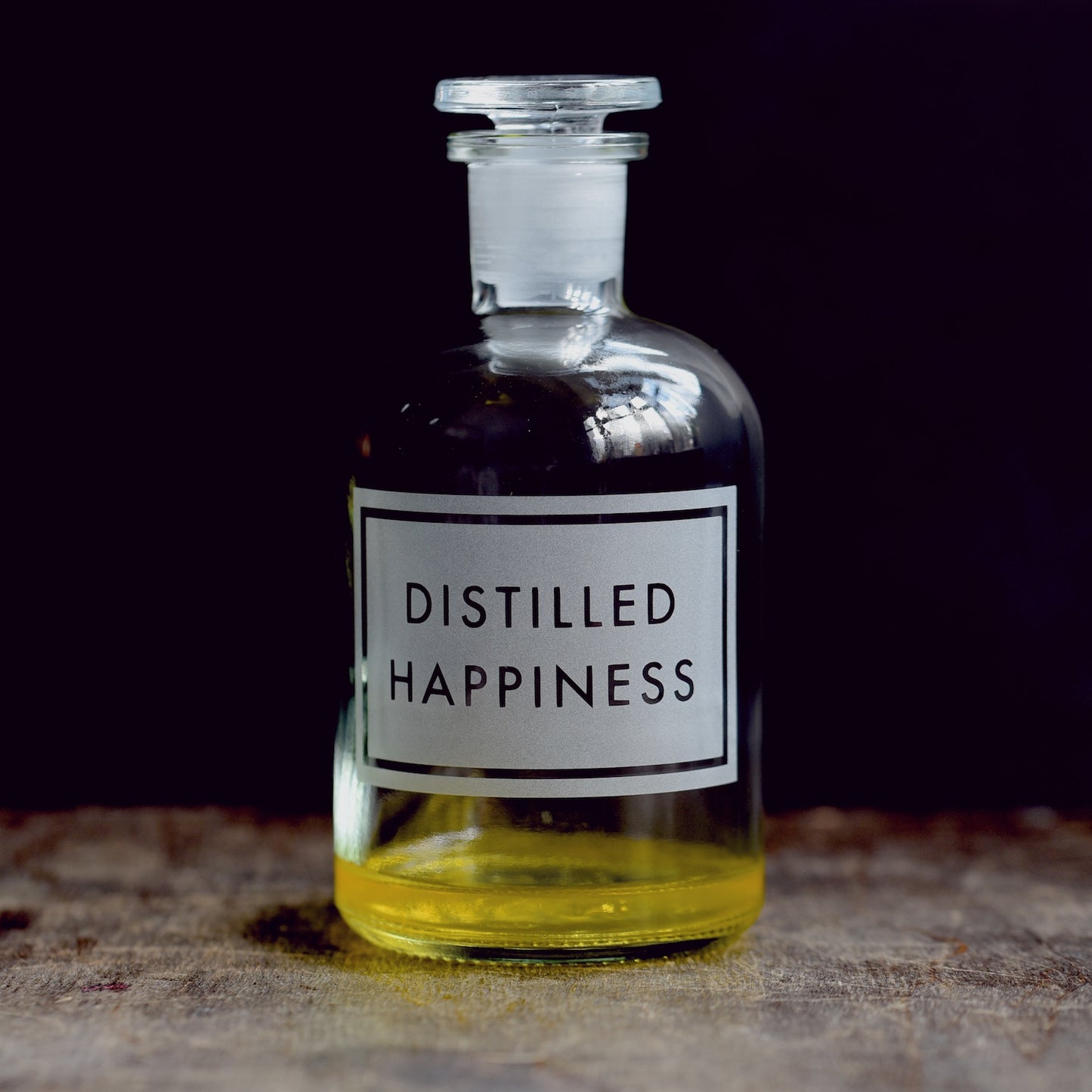 'Distilled Happiness' etched glass apothecary bottle