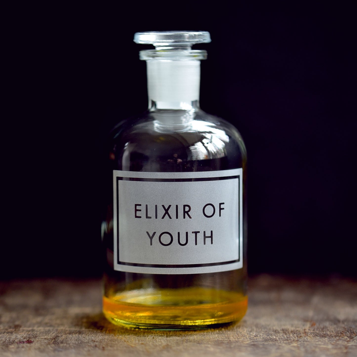 'Elixir of Youth' etched glass apothecary bottle