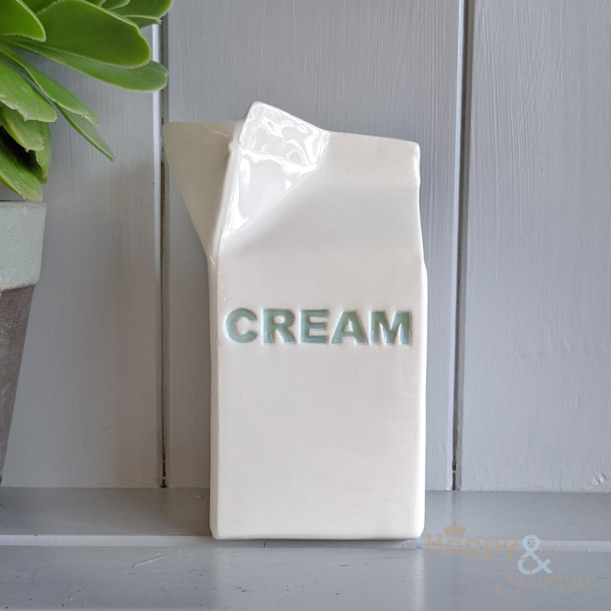 Green ceramic cream carton jug