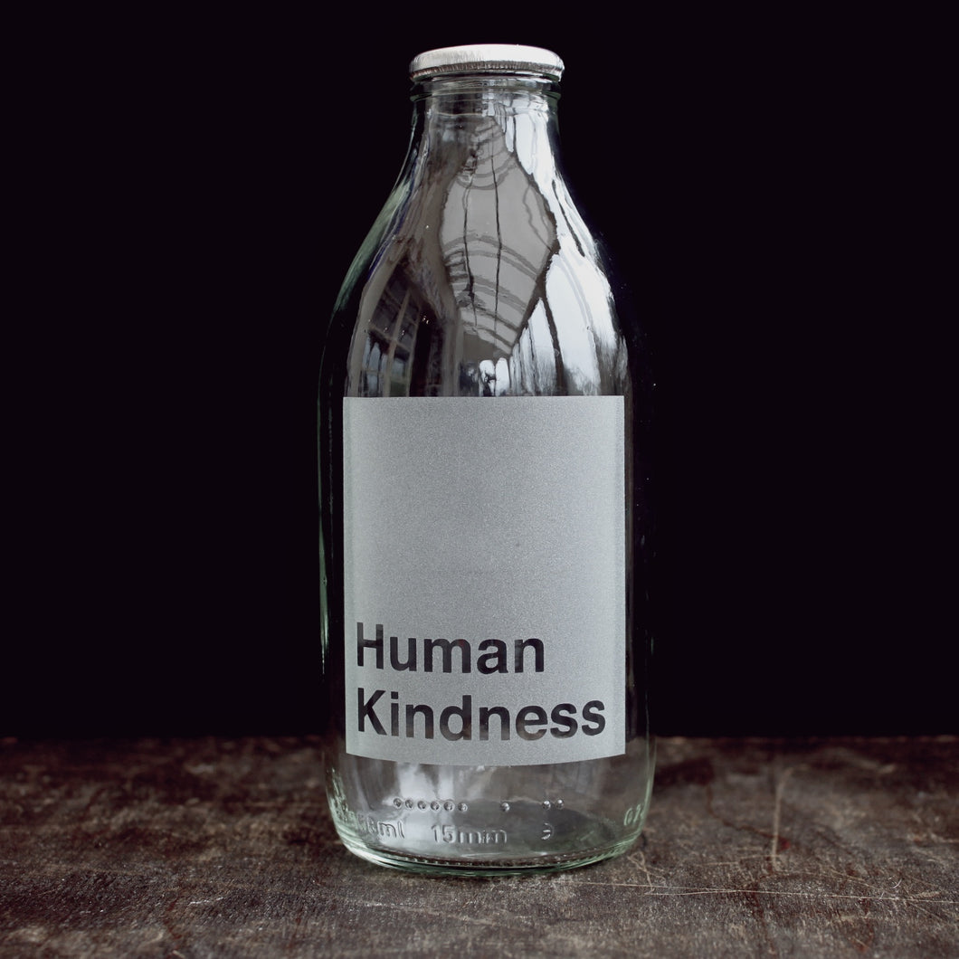 'Human Kindness' etched glass milk bottle