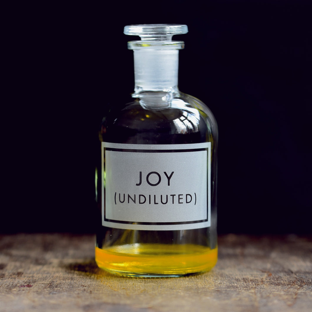 'Undiluted Joy' etched glass apothecary bottle