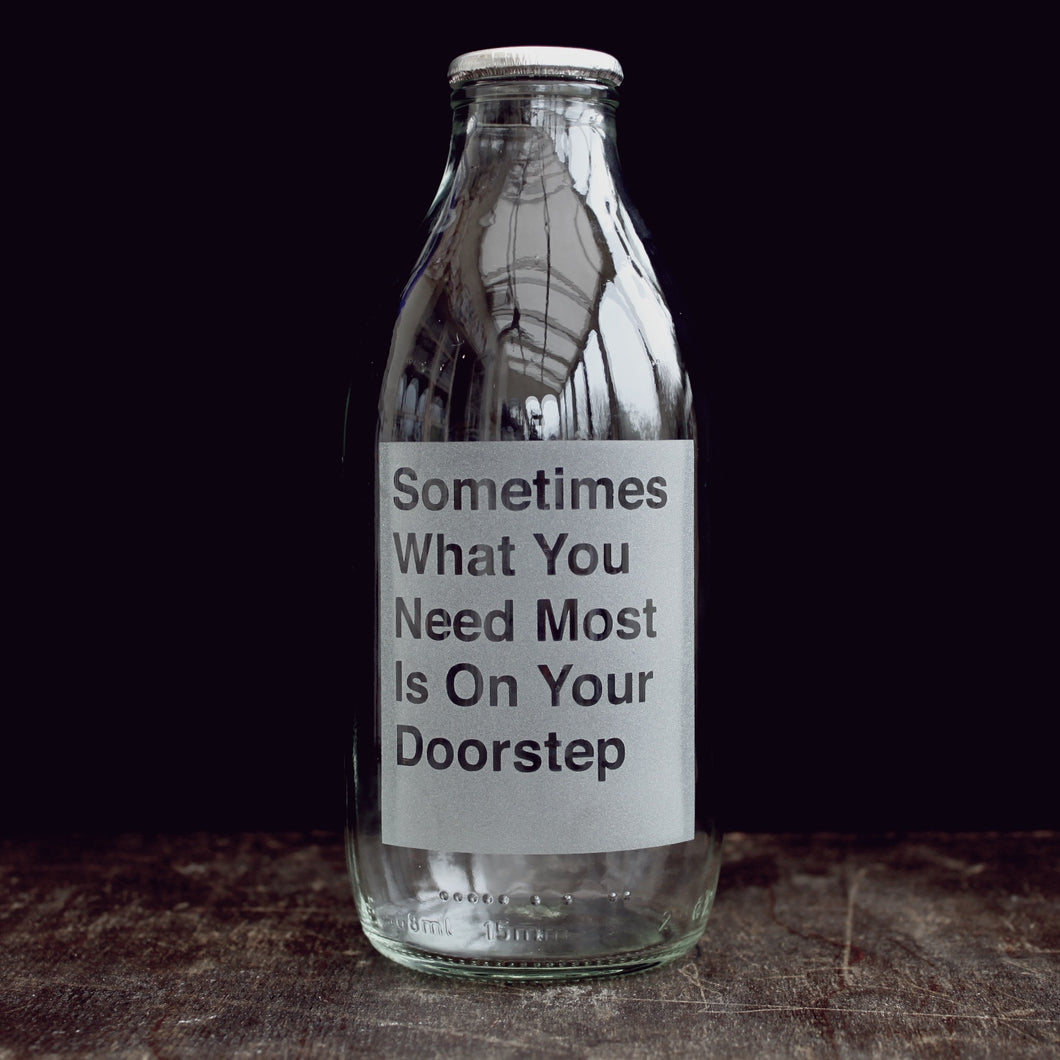 'On your Doorstep' etched glass milk bottle